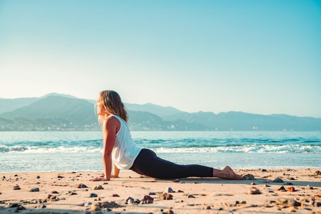 Yoga session by the beach at sunrise
