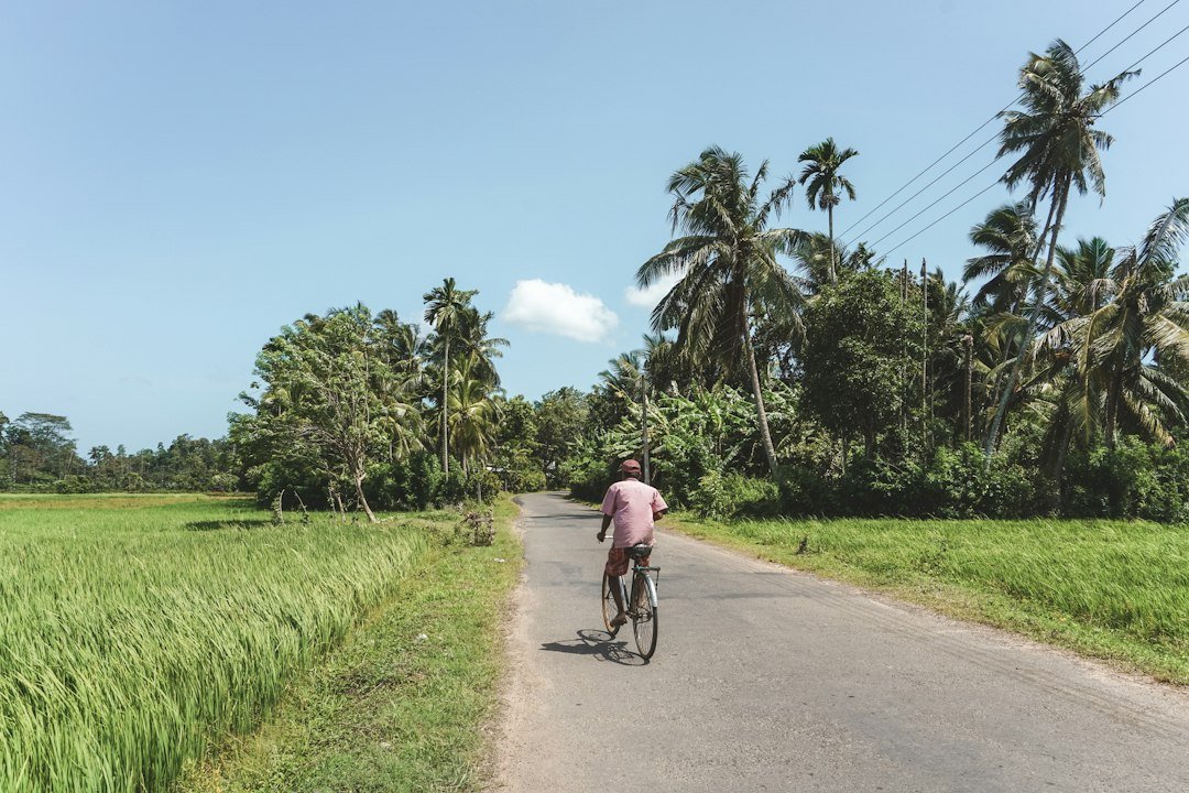 Cycling through a Sri Lankan village near Arugam Bay