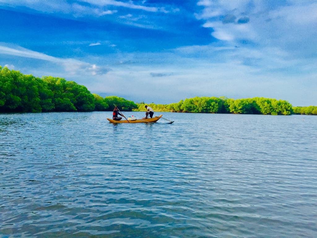 Yellow fishing canoe on Pottuvil lagoon