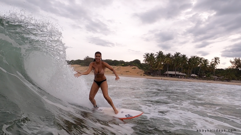 Surfer riding a wave in Arugam Bay